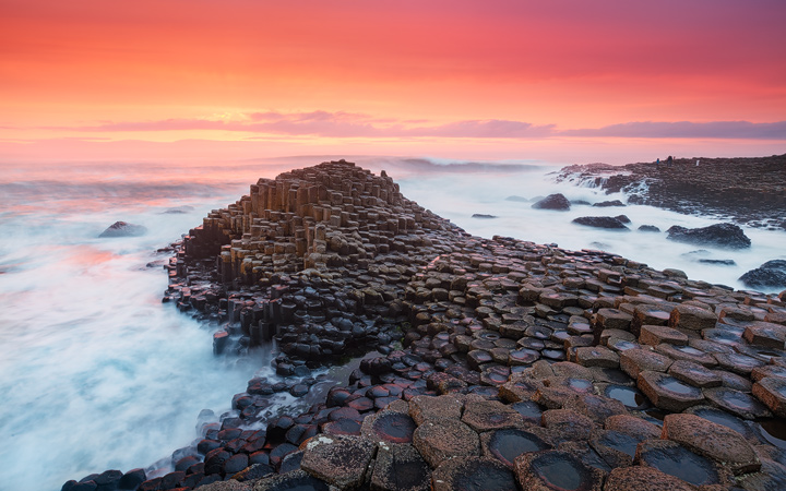 Waves crashing on the rocks of Giants Causeway