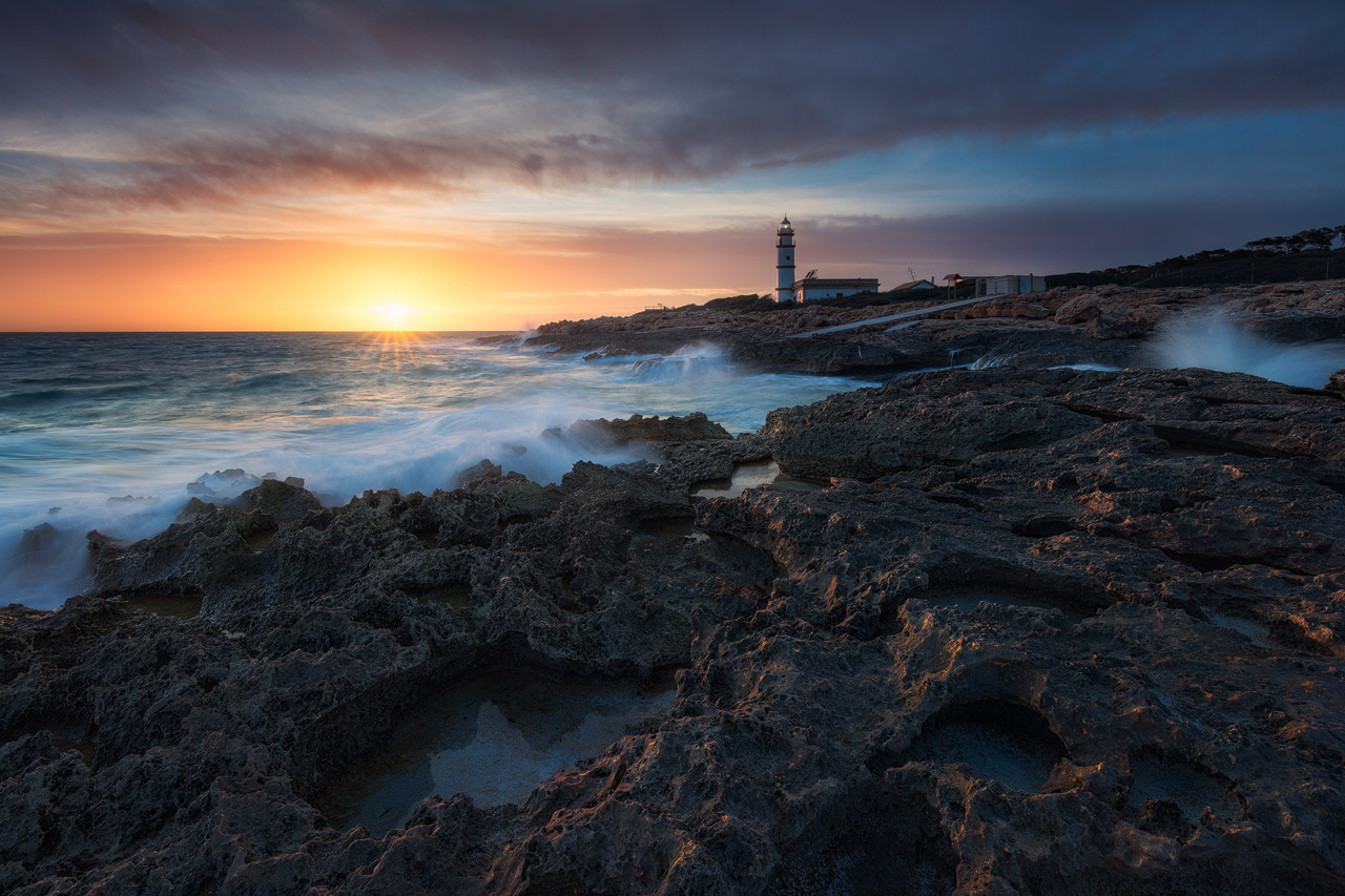 Ses Salines Lighthouse lit by the setting sun