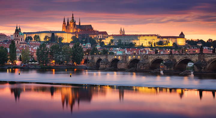 Colorfull skies over Prague and river Moldau