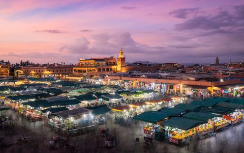 Marrakesh Sunset Evening mood at Jemaa El Fna with a beautiful sunset sky above.