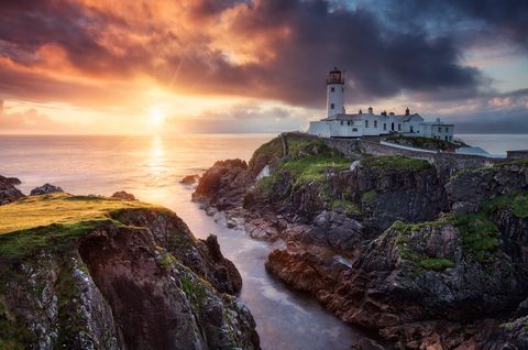 Fanad Sunrise The sun rises behind the Fanad Head Lighthouse.