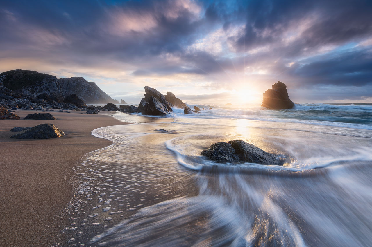 Dramatic sunset at one of the most spectacular beaches in Europe, Praia da Adraga