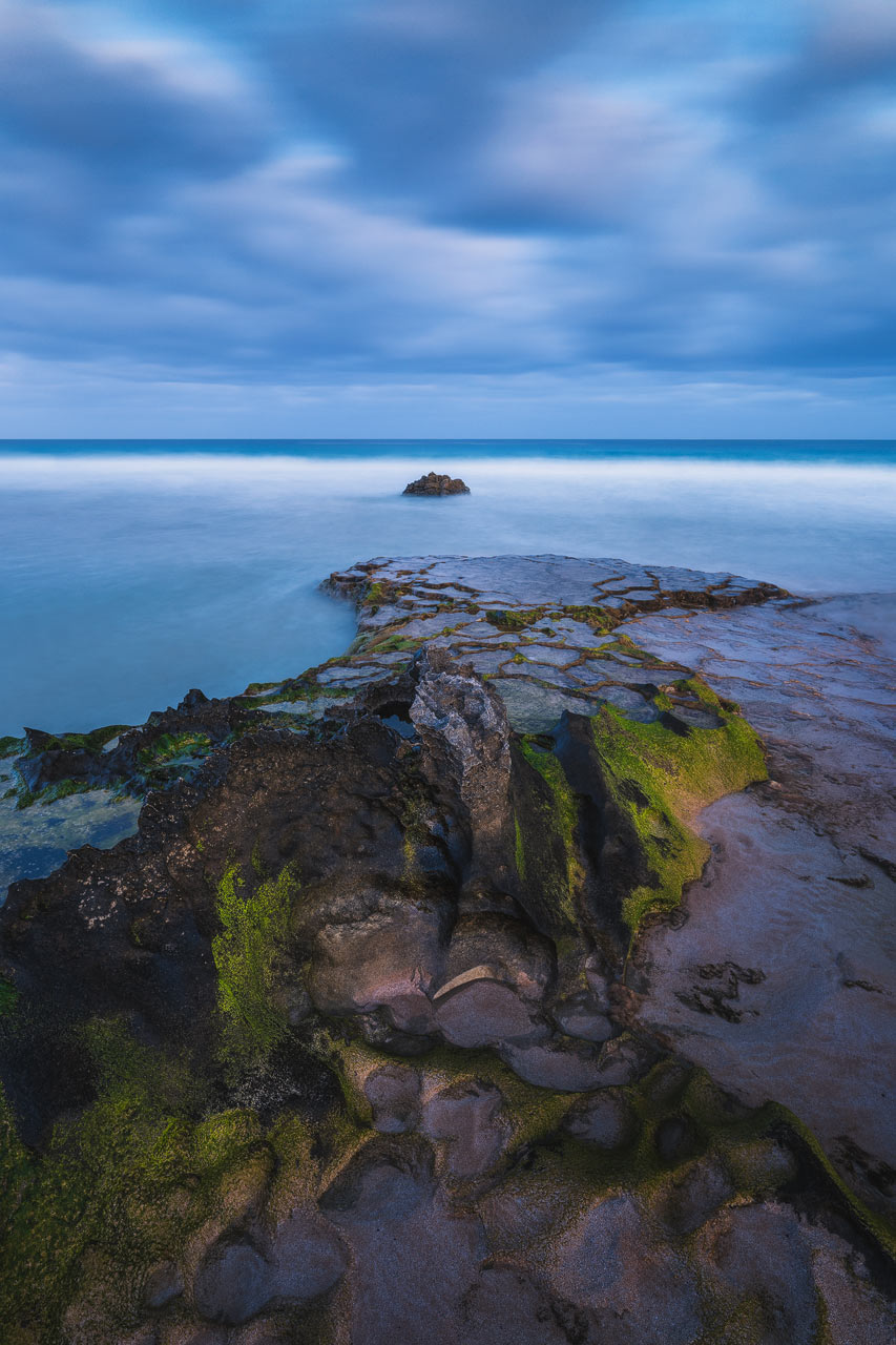 Rocks at El Cotillo beach during the Blue Hour.