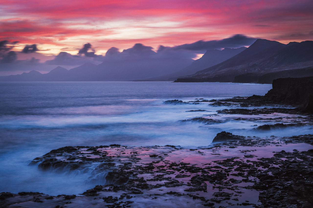 A colorful dawn over the Jandia mountains as seen from Punta Pesebre.