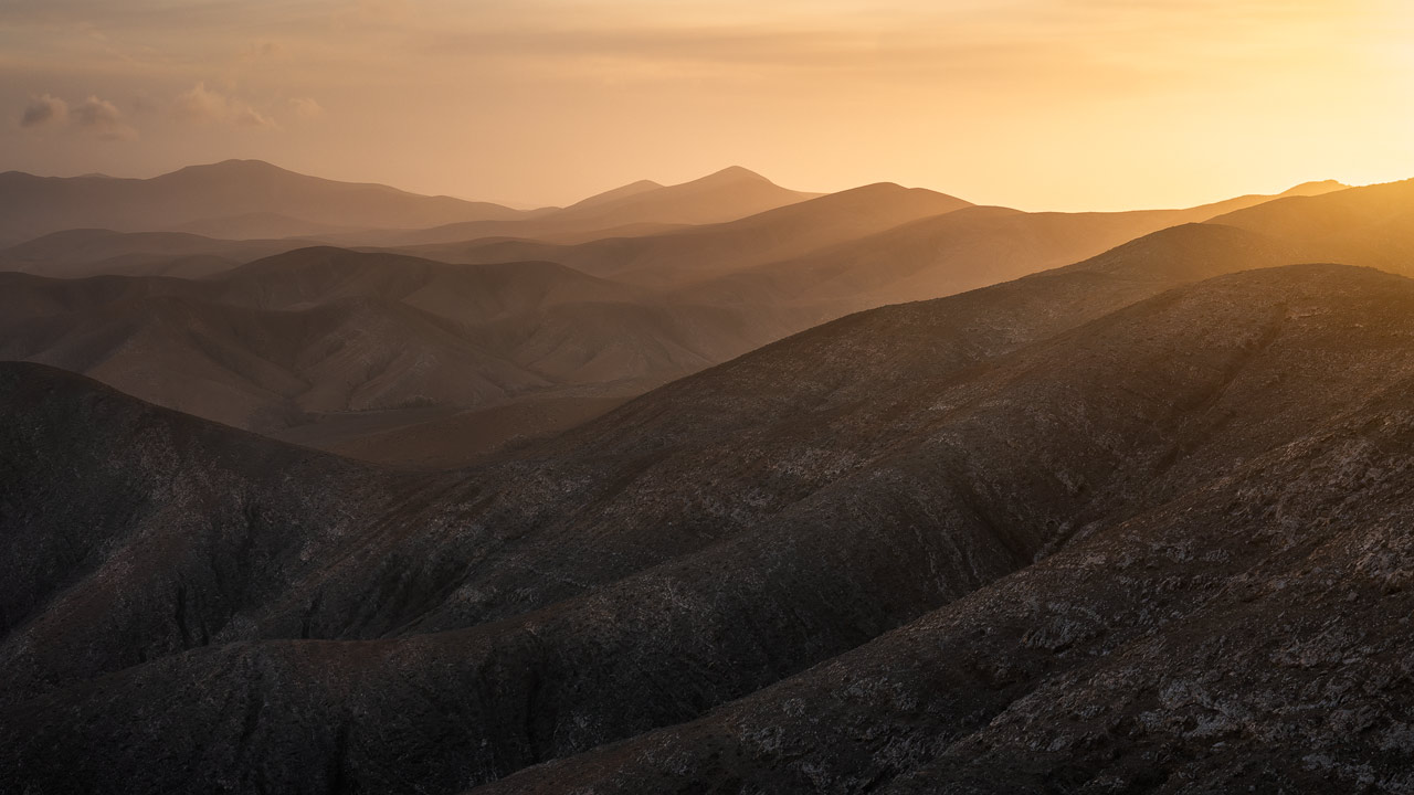 The rolling hills of Fuerteventura's inland in golden morning light.