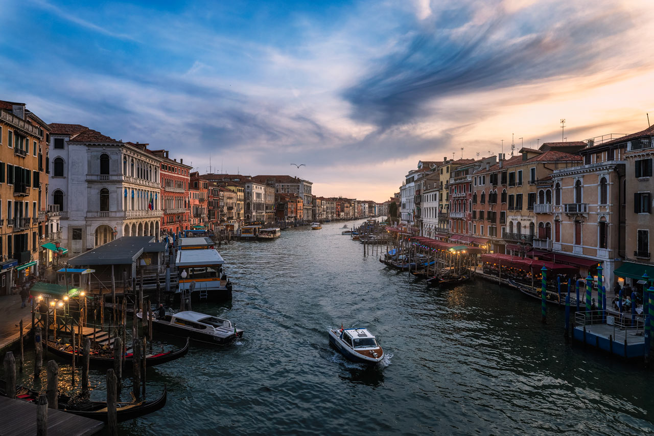 View from the top of the Rialto bridge along Canal Grande during sunset.